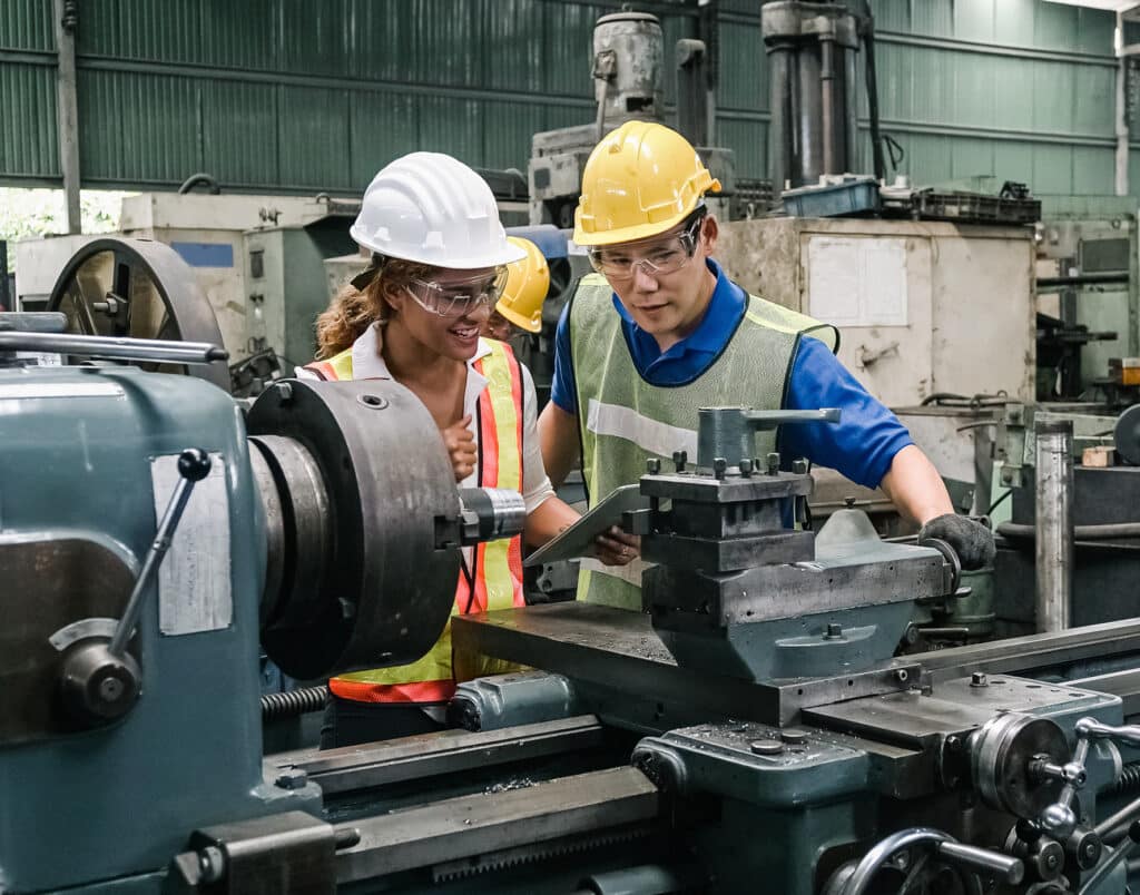 Teamwork professional engineer working heavy industry in factory.