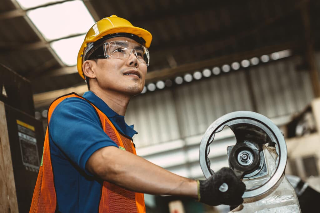 Worker working in production line process with happy smiling in factory.